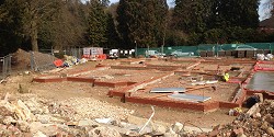 Footings and the first courses of brickwork on a building plot